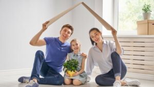 Home Remodeling Contractor Img 3 couple with child enjoying house after home remodeling contractors completed work