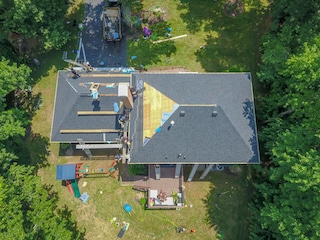 aerial photo of ace roofing remodelers and contractors working on roof aerial photo of ace roofing remodelers and contractors working on roof