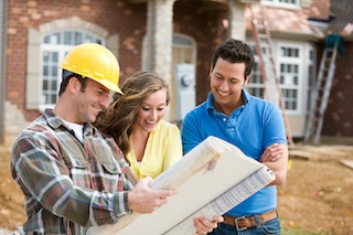 professional remodelers review plans with happy couple house renovation professional remodelers review plans with happy couple house renovation