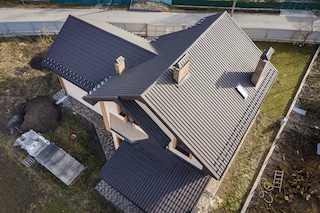 metal roof installation of tiles on new home by ace construction and remodeling metal roof installation of tiles on new home by ace construction and remodeling